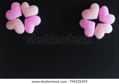 Valentines day with pink hearts as flowers on blackboard with copy space.