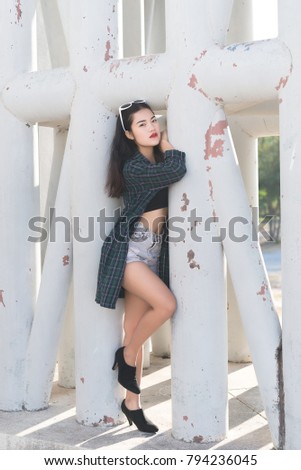 Portrait of beautiful asian woman,Hipsters girl for take a picture outdoor,Thailand people stand on stair