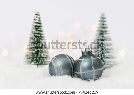 Winter background with Christmas balls and trees