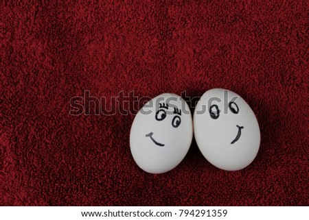 valentines day eggs are in love in the right of a red fluffy background