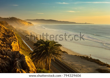Sunset and marine layer at the Terry Pine beach, San Diego California, facing La Jolla city  Royalty-Free Stock Photo #794329606