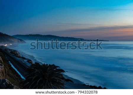 Sunset at the Terry Pine Beach, with blue light in sky, San Diego, California