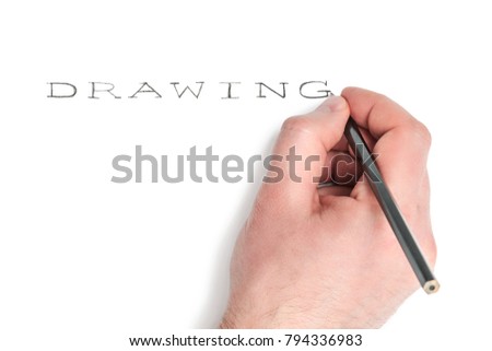Man hand with a pencil writes the word drawing isolated on white background