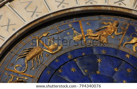 Ancient time and Astrology. Detail of Saint Mark Square renaissance Clock Tower in Venice with zodiac signs Scorpio, Libra Virgo, planet and stars (15th century)