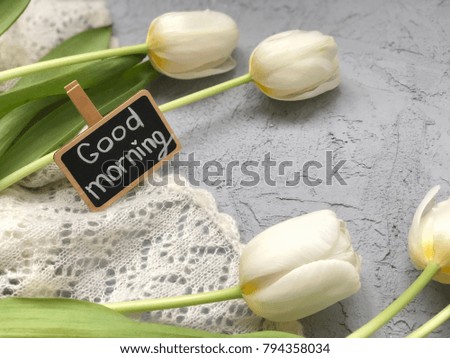 good morning chalkboard with white tulips. concept spring morning. rustic spring morning. 