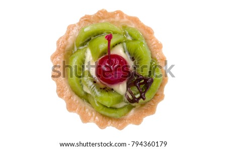 Colorful fruit cake made with kiwi, candied cherry, cream and chocolate isolated on white background.