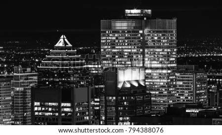Montreal downtown at night in black and white colors. Beautiful canadian city with awesome bright buildings. Montreal view of downtown. Best background for media, banners and other design projects.
