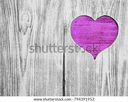 Pinkheart carved in a wooden board. Background. Postcard, valentine.