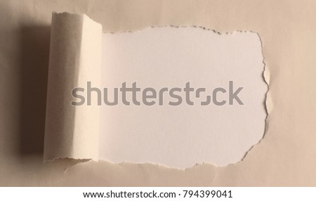 hole in the paper with torn edges.background.