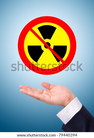 Conceptual image, caring for radioactive usage. Business man care for prohibition of radioactive usage.