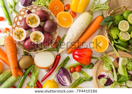 Top view mix diet vegetables healthy care, carrot, lemon, passion fruit.