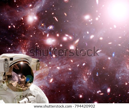 Closeup of astronaut. Deep space and galaxies. The elements of this image furnished by NASA.