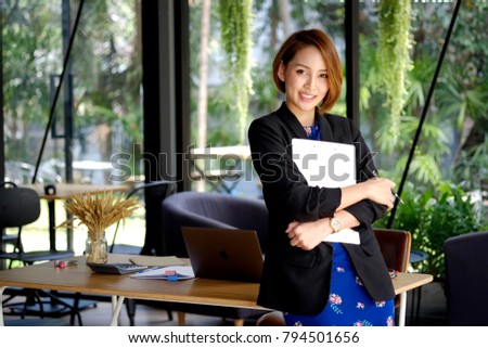 Shot of a businesswoman posing with her arms crossed in a home office.