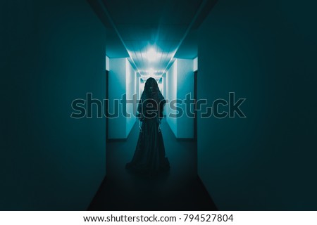High contrast image of a scary ghost in a creepy hotel corridor