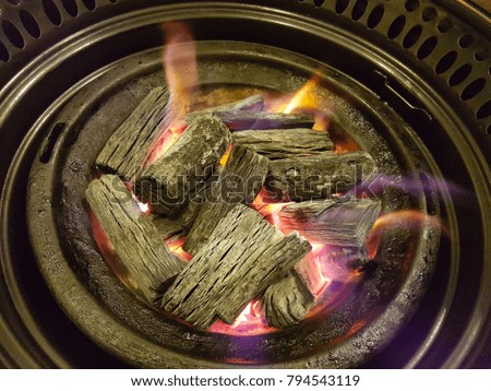 Charcoal roasting in a fire