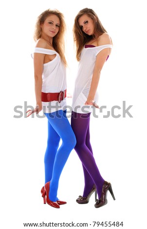 Two young woman in violet colour isolated in white