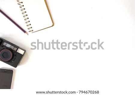 Camera, Notebook and Smartphone on the white background.