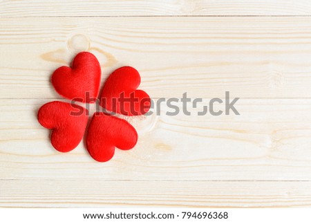Valentine's day / endless love or special occasion concept : Top / overhead view of four big red heart with on wood texture background with copy space. Depicts love passion for romantic couple.