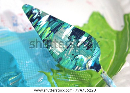 Macro photo of Palette Knife with acrylic paint