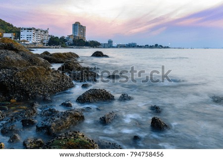 Rocks on the sea with sunset sky