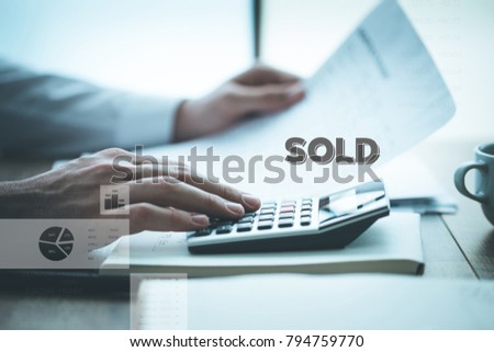 Businessman Analyzing Financial Charts and Sold Concept