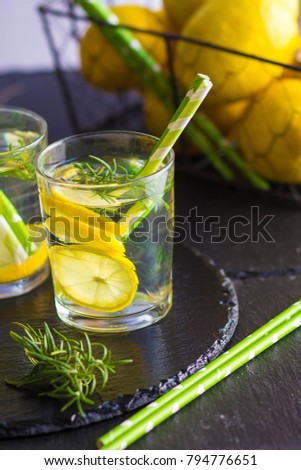 Ingredients for making flu fighting natural hot drink. Oranges, mint, lemons, ginger, honey, apple and spices over plywood background, top view, copy space. Clean eating, detox, dieting concept