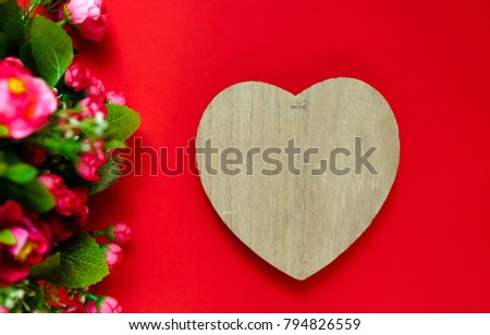 Valentine's day gift for the second half, a bouquet of flowers, a romantic photo, a wooden heart on a red background, background suitable for advertisement , insert text,love