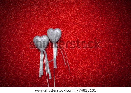 red shiny background with silver hearts, love, Valentine's Day, texture abstract background, romantic picture, suitable for advertisement, insert text,