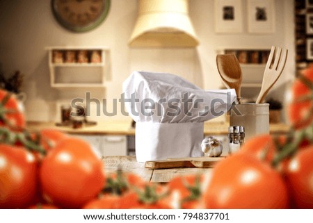 Kitchen interior and cook hat on top. Free space for your decoration 