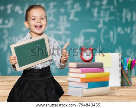 School child and school supplies Royalty-Free Stock Photo #794843455