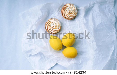 lemon meringue pie with fruits on wooden background. Top view. ,homemade dessert concept