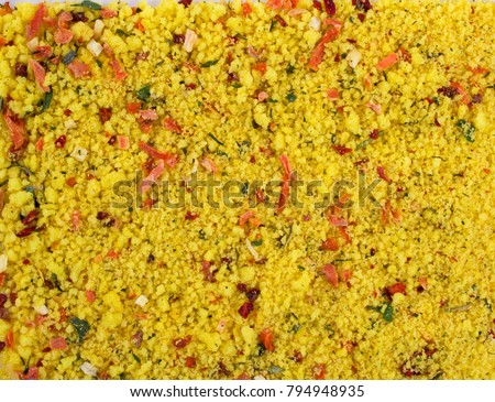 Texture background. Yellow spice mix. Spices consist dried dehydrated  vegetables carrot paprika onion garlic parsnip parsley tomatoes