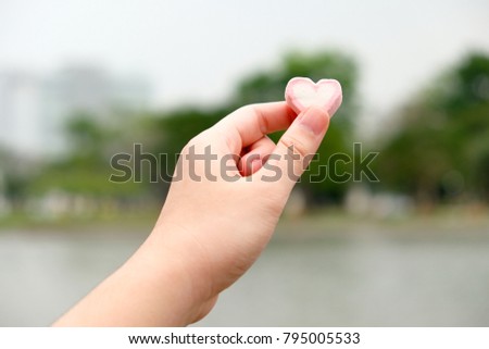 Hand pick up Heart shaped Marshmallow