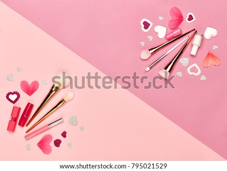 Valentine's Day Background. Red Hearts on a Pink background. Flat Lay. St.Valentine's Day Wallpaper. Make Up Brushes. Lipstick and nail Polish