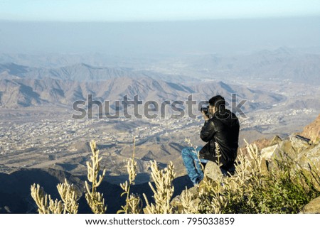 Photographer taking mountainscape at Taif, Saudi arabia