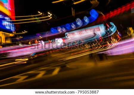 Beautiful lighting of night futuristic LED building abstract. Shooting style light color blur background