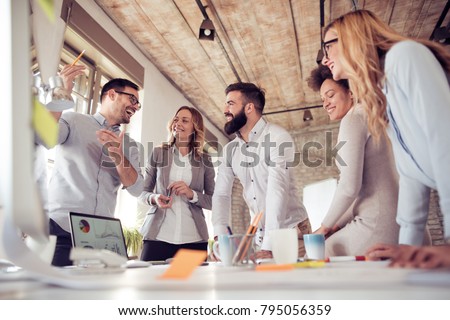 Team of young engineers working together in a architect studio.Start up business. Royalty-Free Stock Photo #795056359