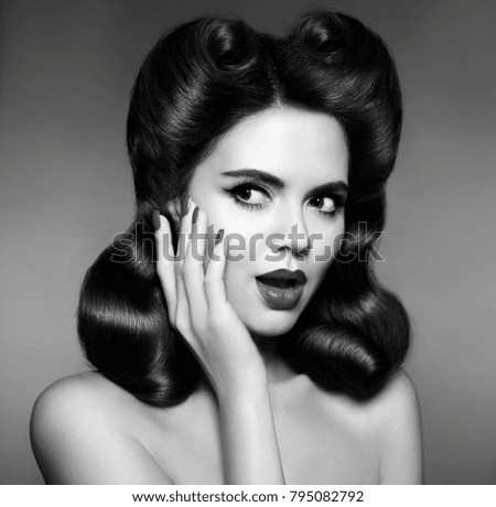 Retro woman portrait. Surprised and shocked 50s pin up girl with hairstyle vintage photo. Lady looking to the side. 