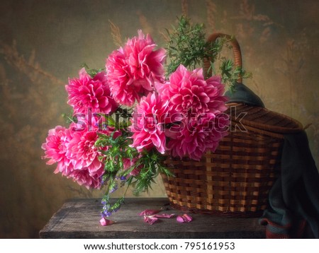 Still life with a basket of dahlias