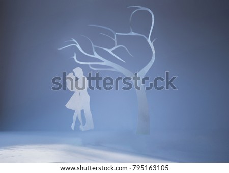 Festive valentine day card background made from paper cut couple under tree