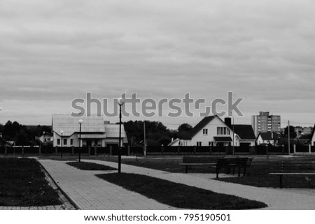 Small private houses in the city. Black and white photo