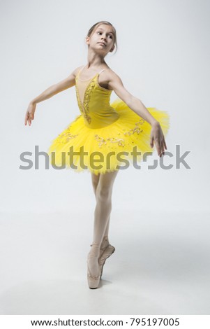 Young classical dancer on white background.
