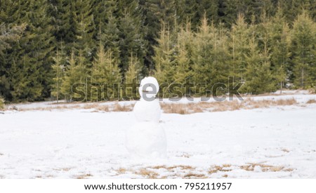 Lonely snowman winter background