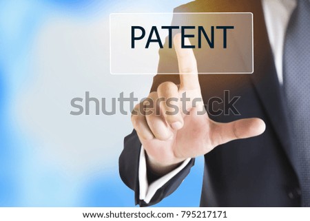 Businessman hand touching PATENT button on virtual screen