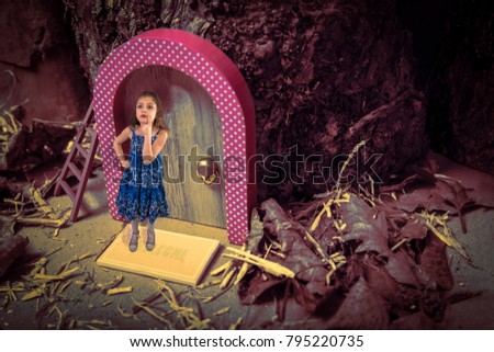 Child on doormat of door in tree. Fantasy, possibly where fairies and elves live. Is anyone home?