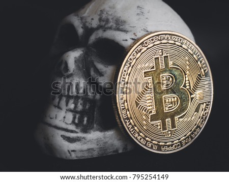 Macro shoot white skull and bitcoin