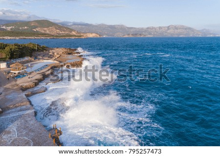 Aerial view of the coast of Montenegro. Storm waves on the Plo?e beach.