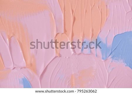 close-up view of abstract pink, orange and blue painting background