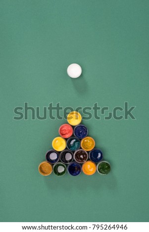 top view of billiard ball with colorful paints on green billiard table