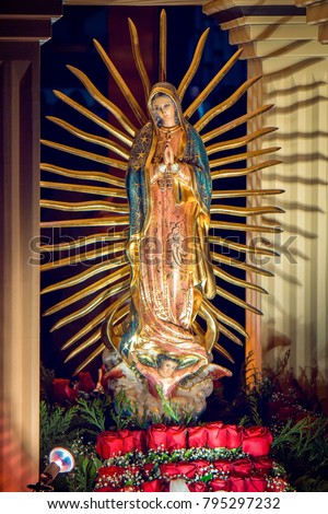 The image of Our Lady of Guadalupe, displayed at the modern Basilica of Our Lady of Guadalupe in Mexico City. Royalty-Free Stock Photo #795297232